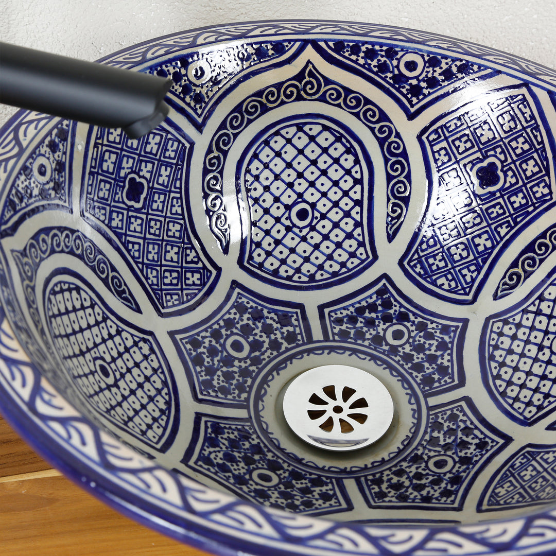 Lavabo sobre encimera azul redondo