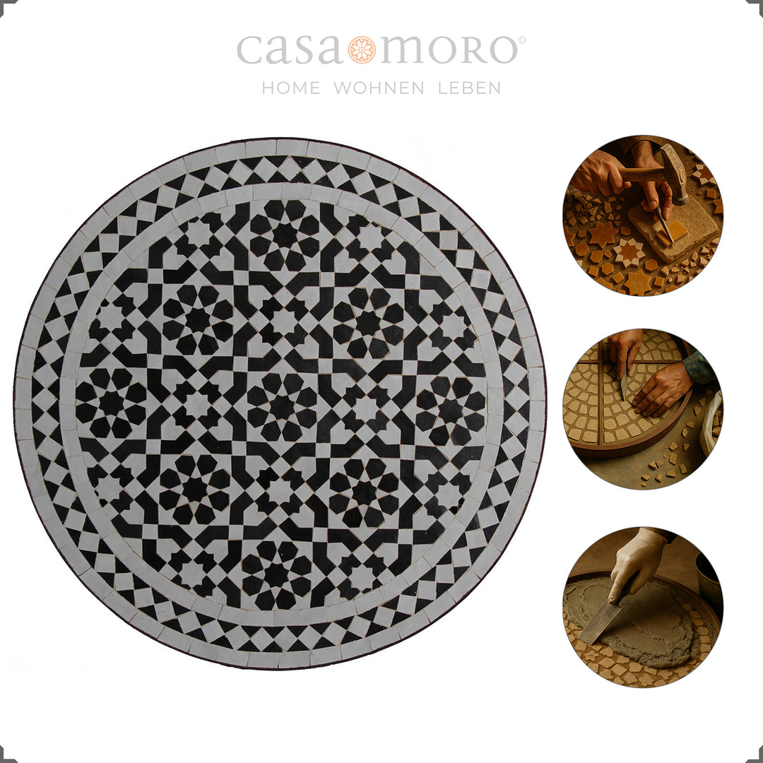 Mosaiktisch mit kunstvollem schwarz-weißem Muster und geschwungenem Gestell