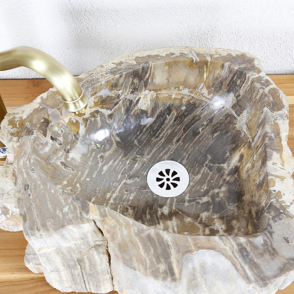 piedra natural Lavabo Fabricado en madera fósil de expresiva veta, vista interior con desagüe y superficie suavemente lijada.