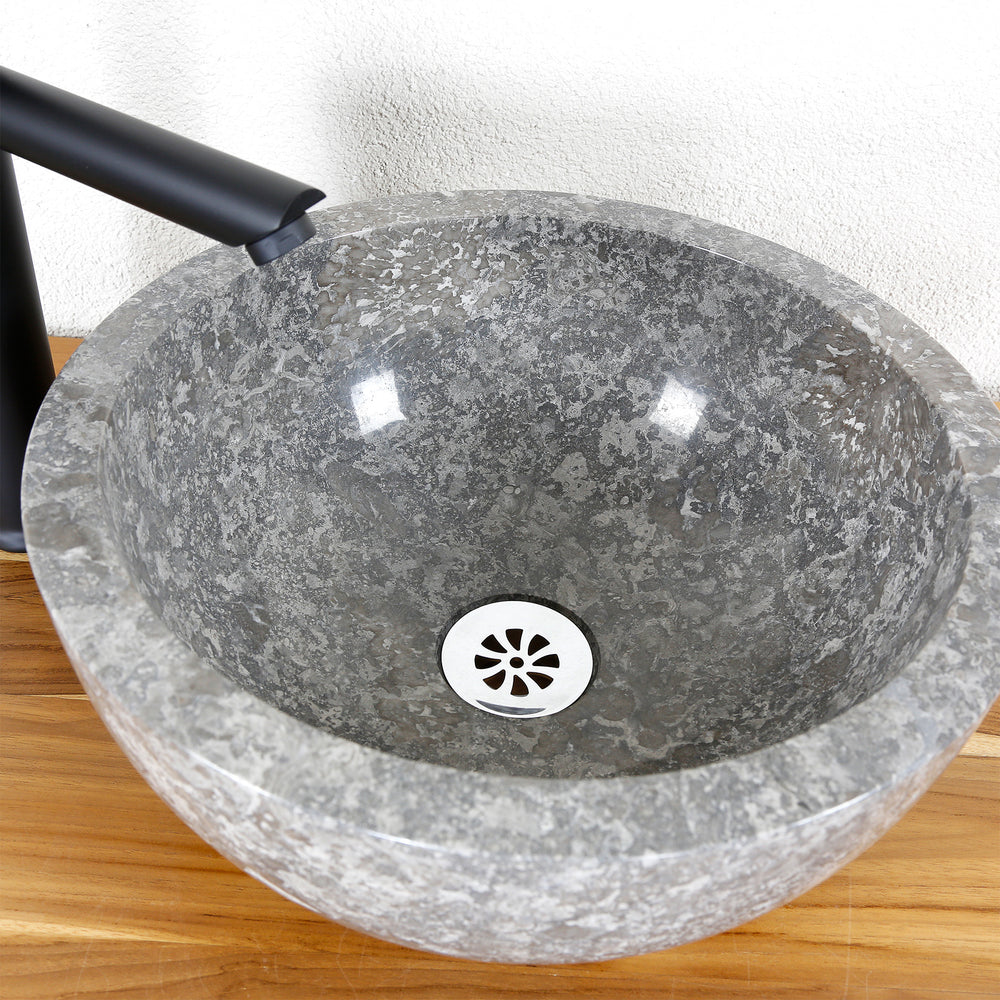 Lavabo sobre encimera de piedra natural en color gris, interior pulido, redondo Lavabo con accesorios negros