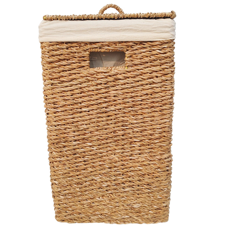 Cesto rectangular para la ropa de algas marinas con una capacidad de 90 litros, tapa cerrada, asa y forro de tela clara.